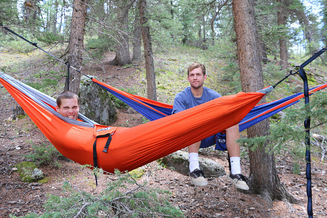 Two men in camping hammocks