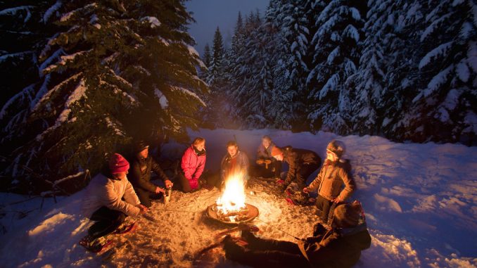 Outdoor Comfort round a campfire in winter snow
