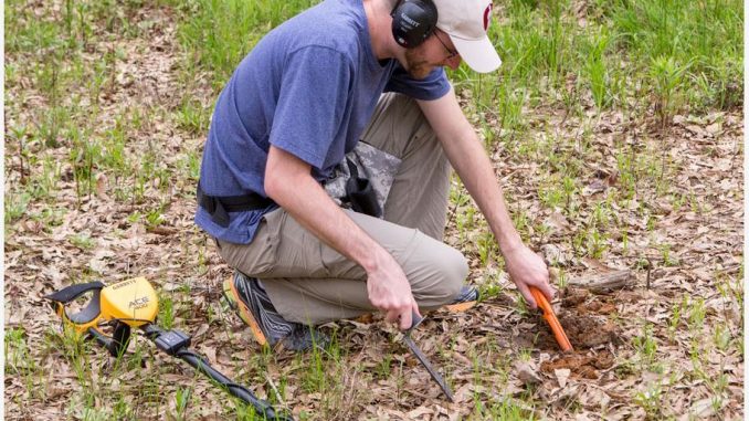 Using a pinpointer for accurate metal detection and treasure hunting
