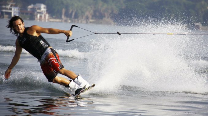 Mam wakeboarding on a lake
