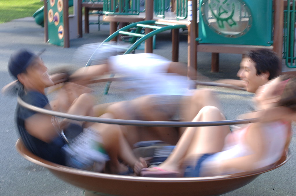 teens enjoy this playground equipment for social spinning