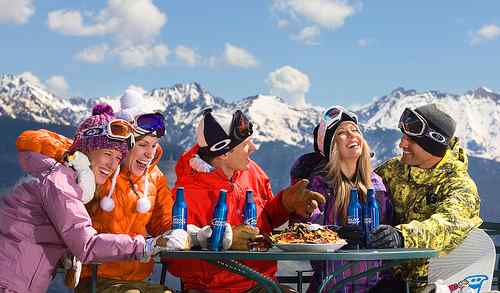 Enjoying food and drink on and off the Piste with friends on a ski holiday