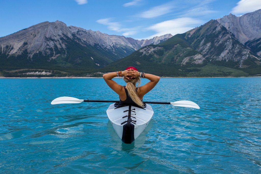 woman kayaking on a lake